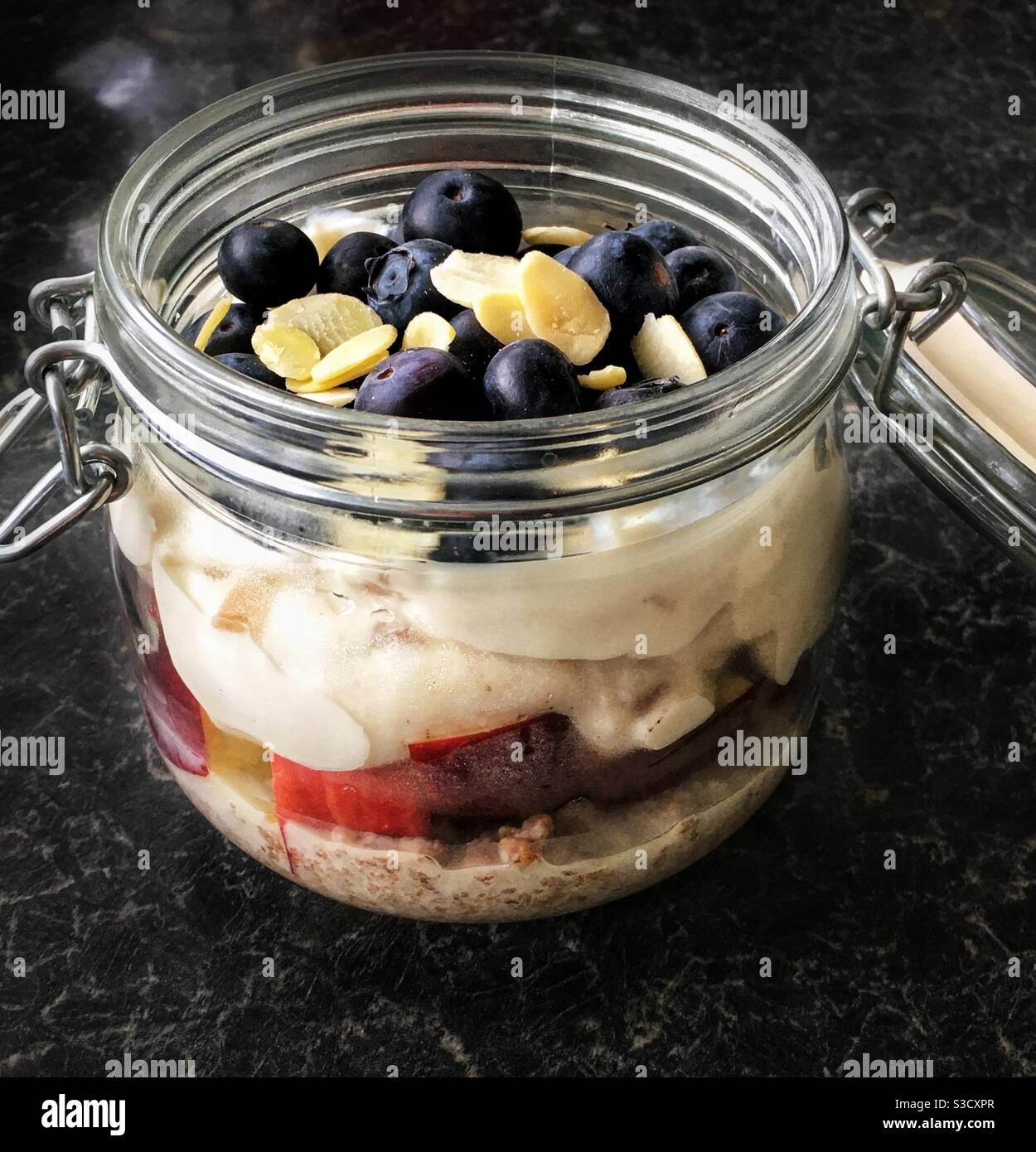 Layered cereal, yogurt, fruit and nuts in a Kilner jar Stock Photo Alamy