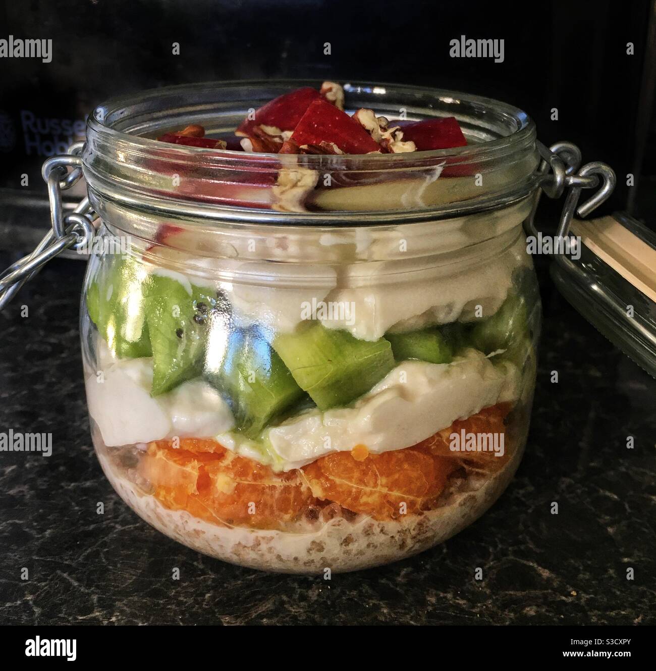 Layered breakast of cereal, fruit and yogurt in a Kilner jar Stock Photo Alamy