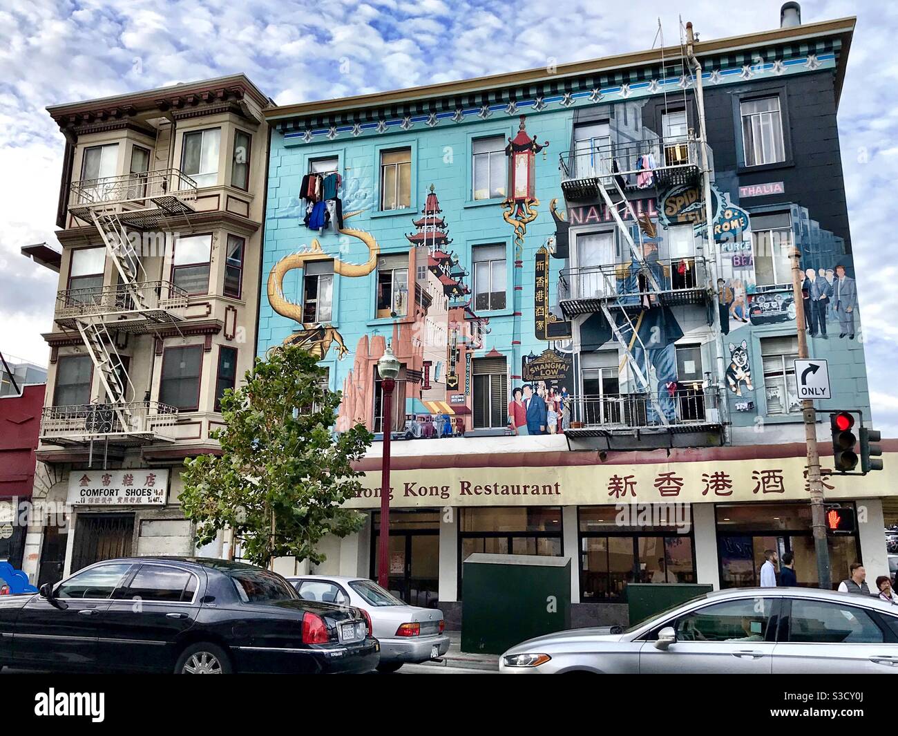 Colourful urban art on front of 4 storey building on Broadway, China Town, San Francisco, USA Stock Photo