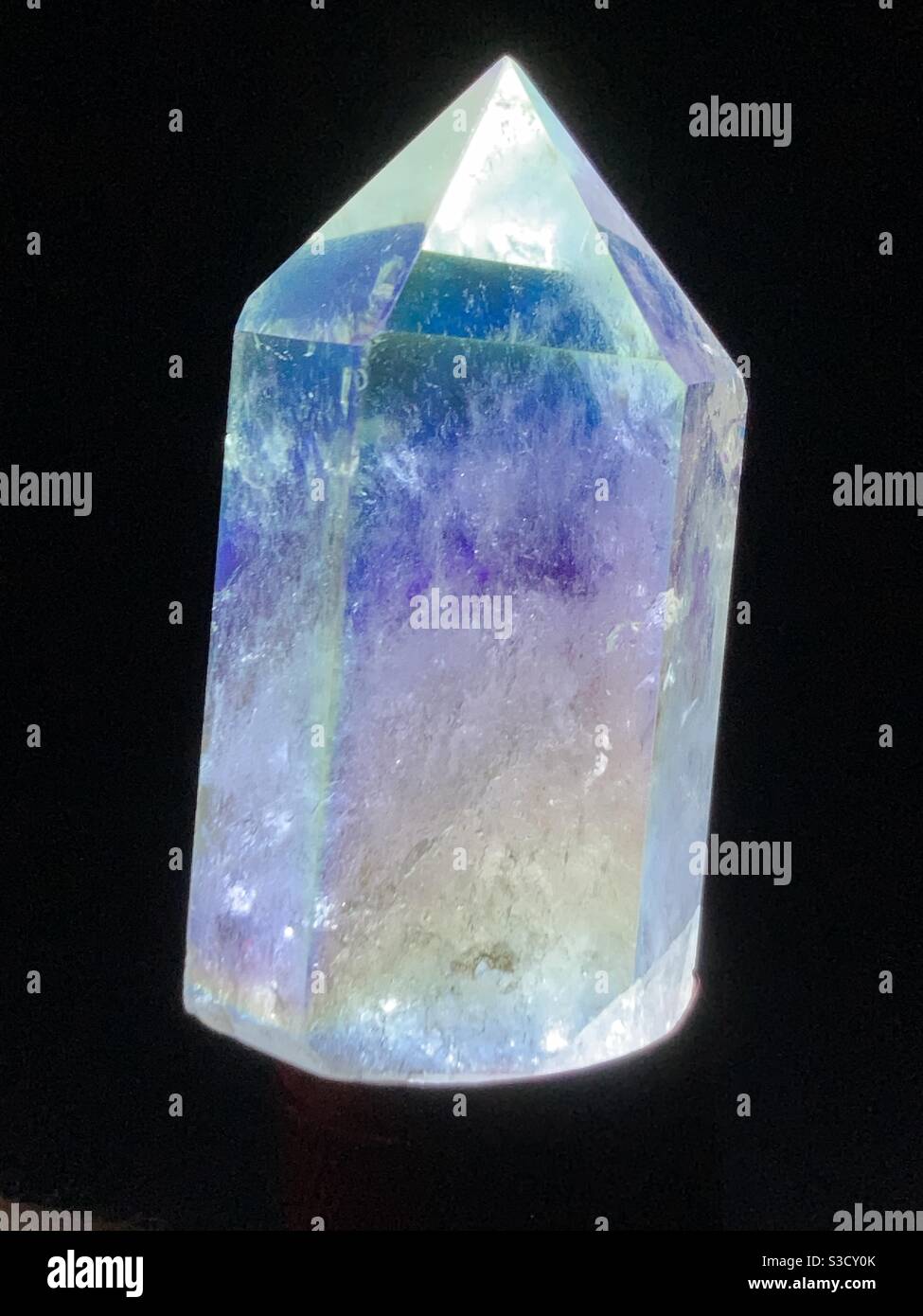 Backlit picture of a bismuth quartz in cone shape, rocks, gems Stock