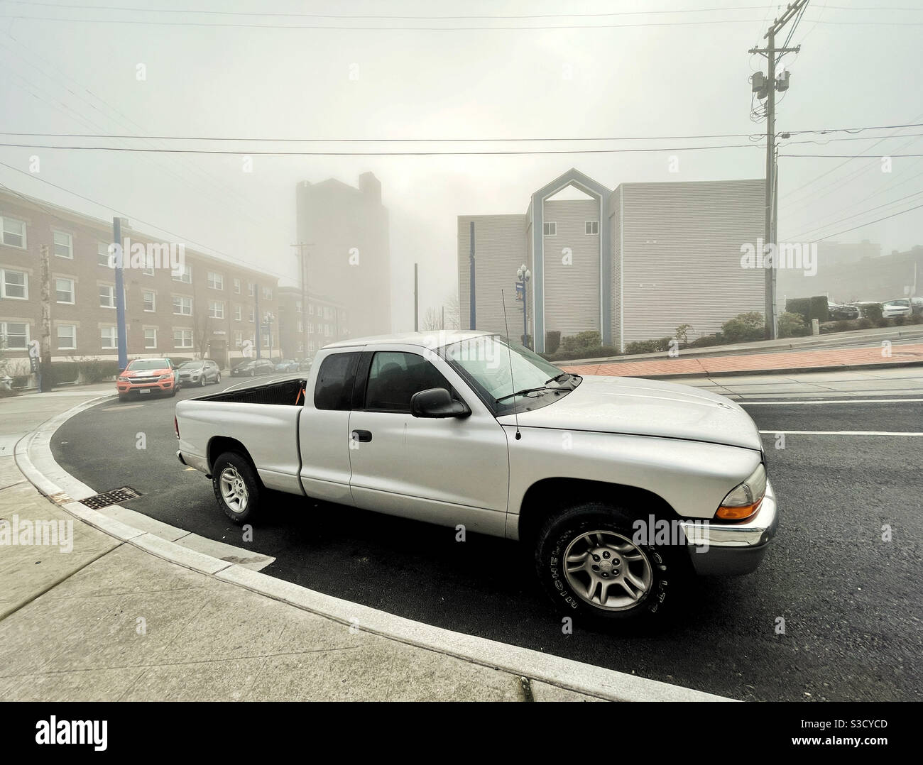 Typical american car - truck on a street in Tacoma in the fog - Smartphone Captured Stock Image