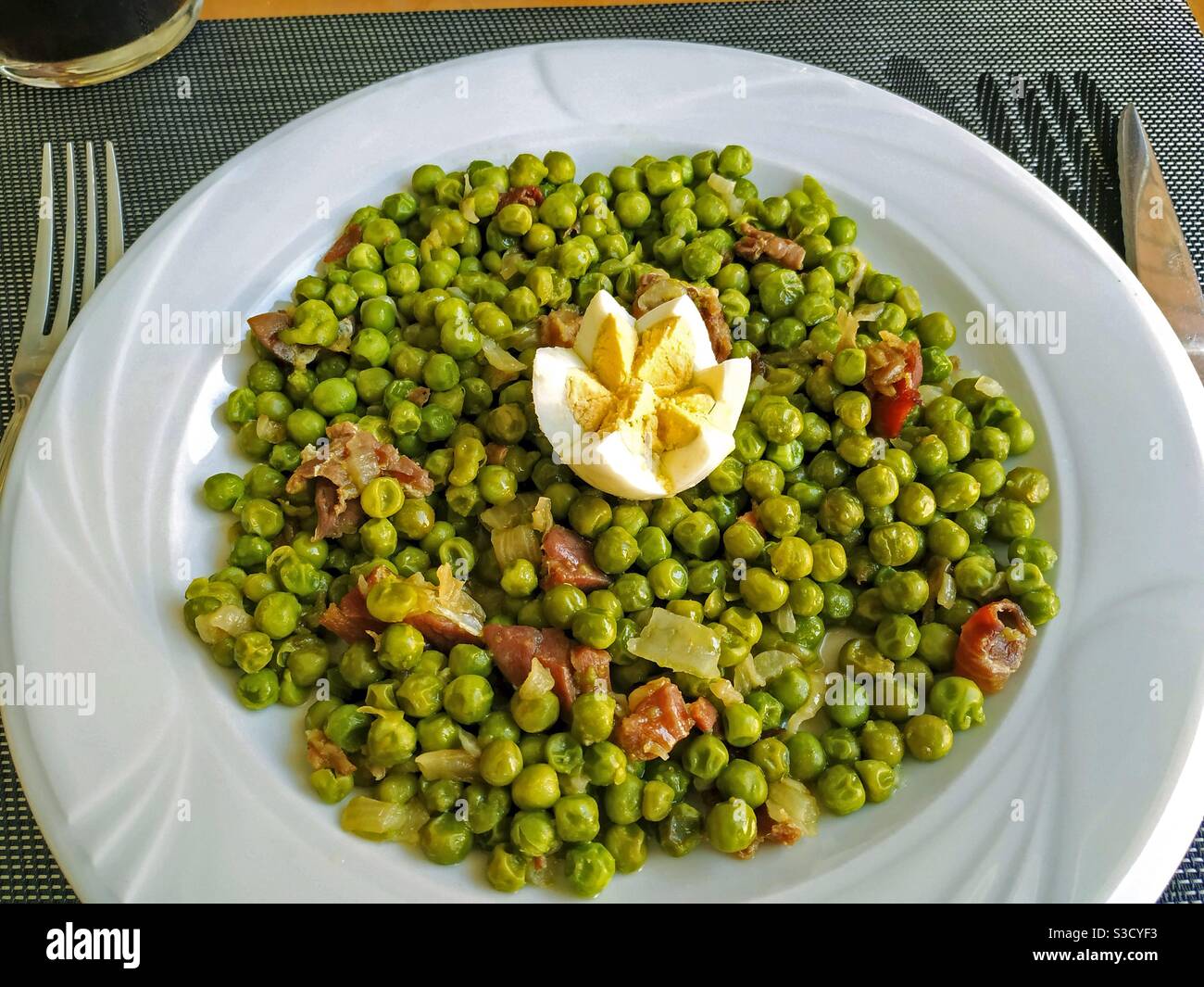 Peas with ham and egg. Stock Photo