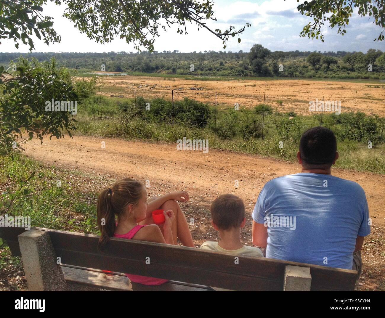 Family enjoying sundowners and wildlife spotting on the banks of the Crocodile River, Mpumalanga - Smartphone Captured Stock Image
