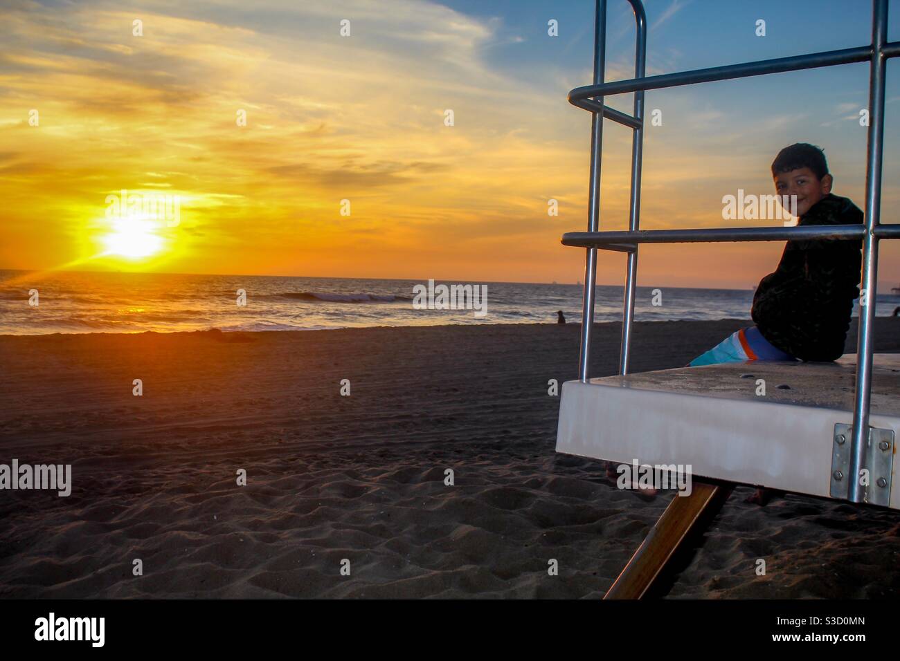 Hanging out with son at Huntington Beach Ca Stock Photo