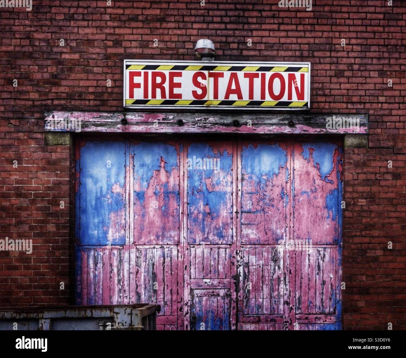 A vintage fire station entrance that is abandoned and disused - Smartphone Captured Stock Image
