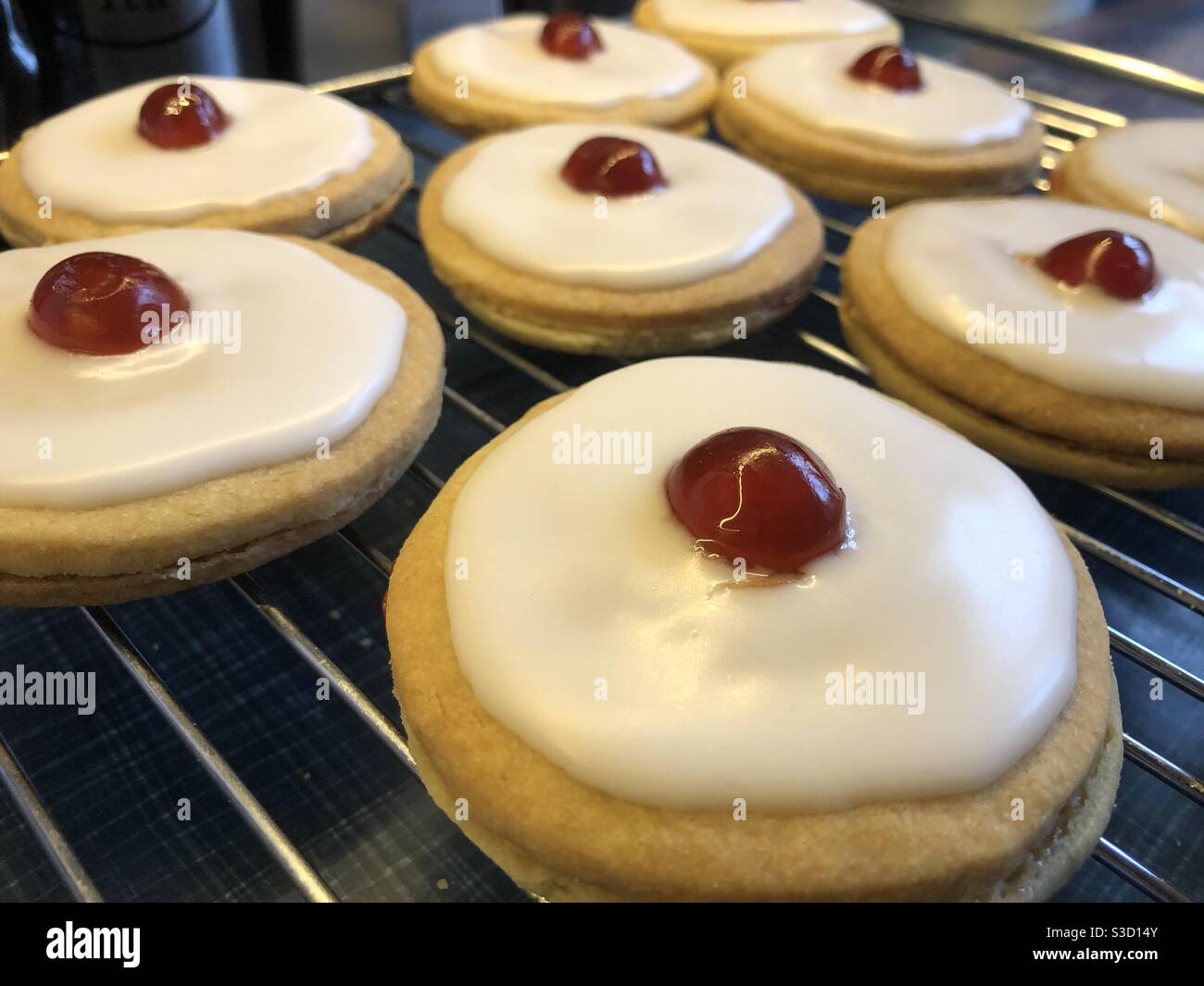 Shortbread cookies with icing and cherry Stock Photo