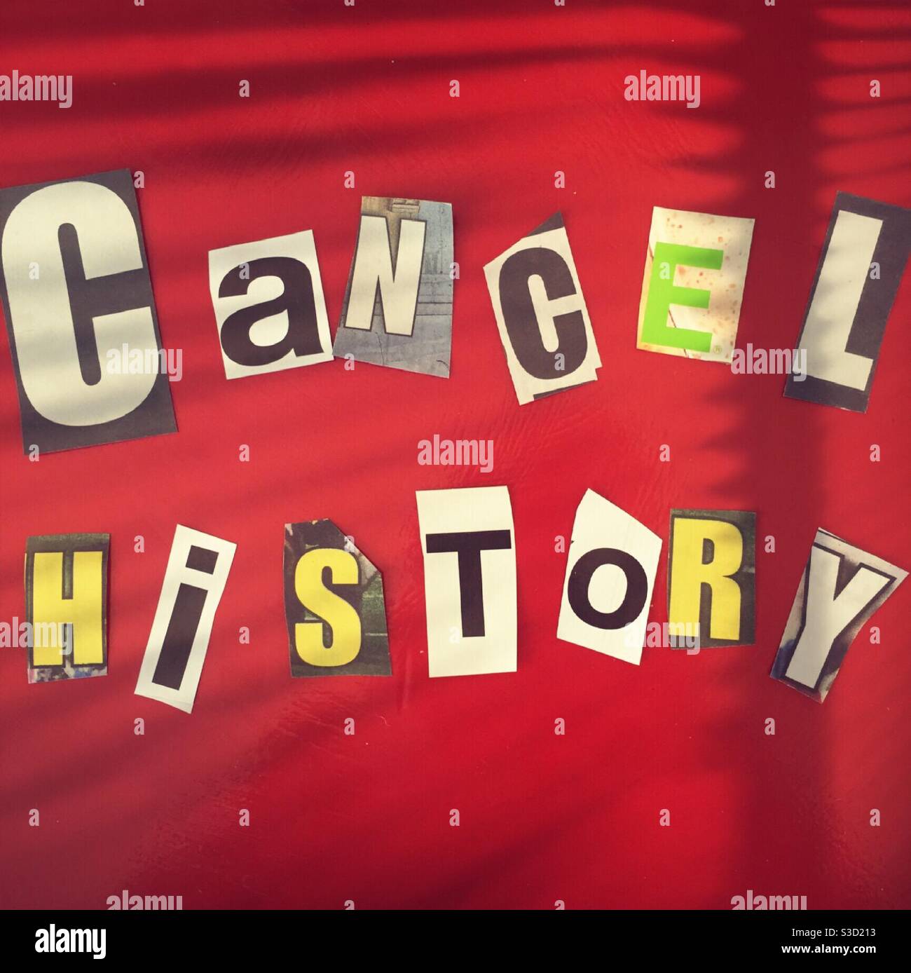 The phrase cancel history using cut out paper letters in the ransom note affect, USA - Smartphone Captured Stock Image