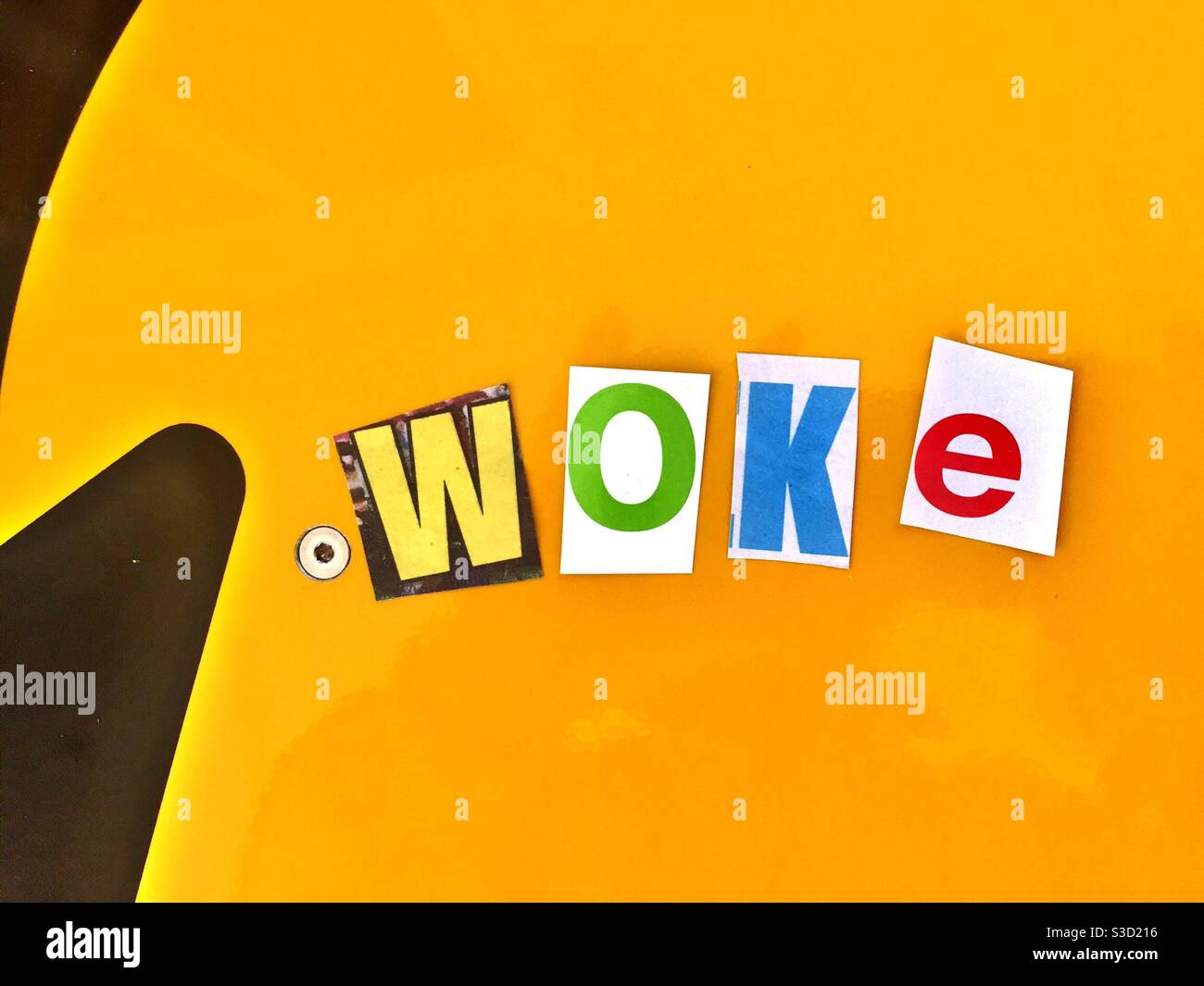 The word woke using cut out paper letters in the ransom  note effect Stock Photo