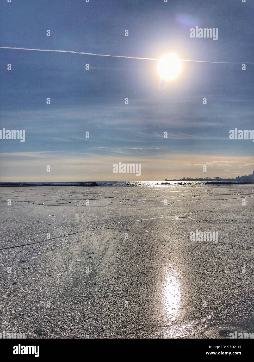 Sun reflections on icy water. Stock Photo