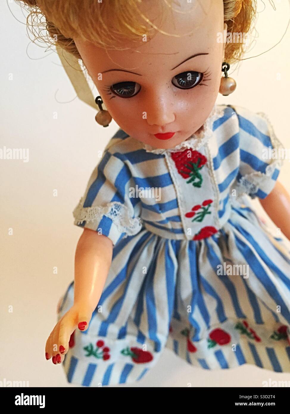Vintage Vogue Jill doll in a blue and white striped shirt dress outfit - Smartphone Captured Stock Image
