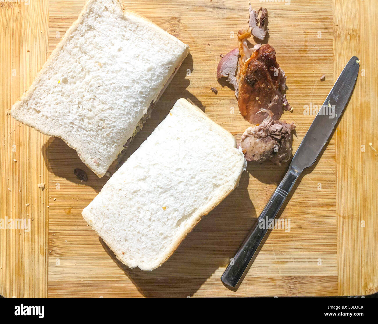 Homemade sandwich on a wooden chopping board. - Smartphone Captured Stock Image