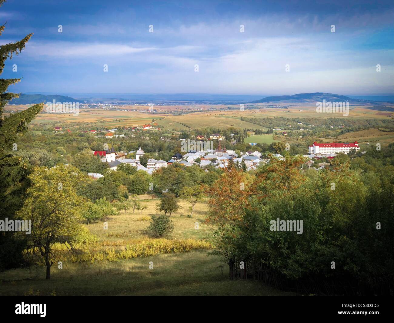 Village surrounded by mountains seen from the distance - Smartphone Captured Stock Image