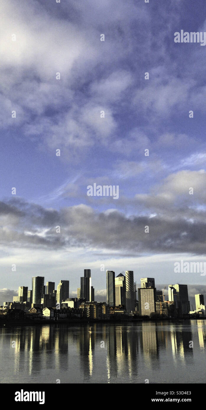 Canary Wharf financial and banking district with reflections of skyscrapers in the river Thames, London uk - Smartphone Captured Stock Image