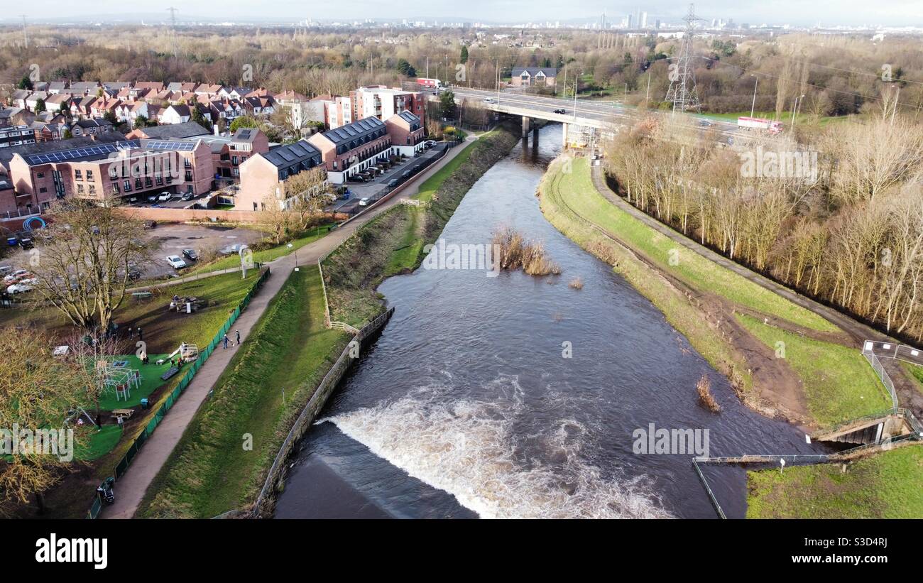 Riverside park in northenden Manchester next to the river Mersey , with its weir,on a beautiful sunny winters day Stock Photo