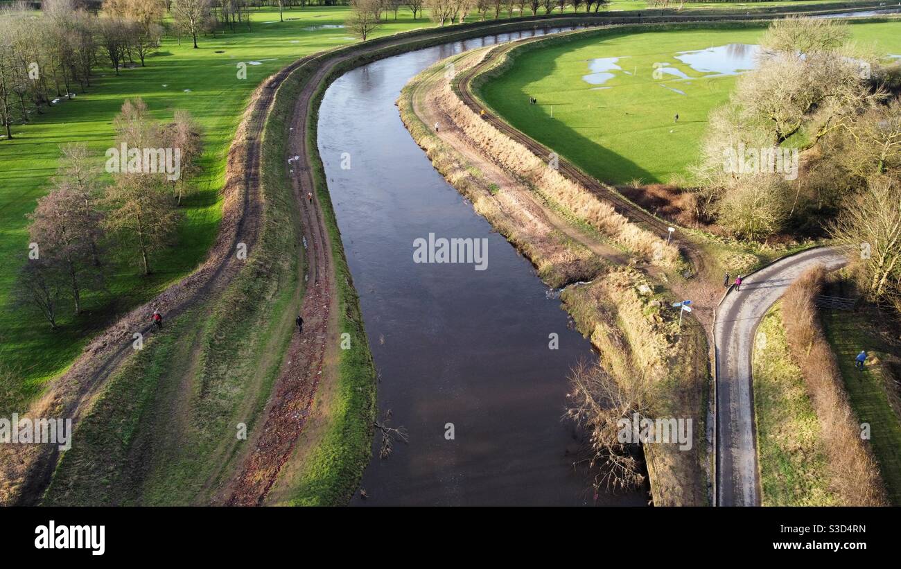 The river Mersey in northenden Manchester on a beautiful sunny winters day, with flooding in the nearby golf links after storm christoph Stock Photo