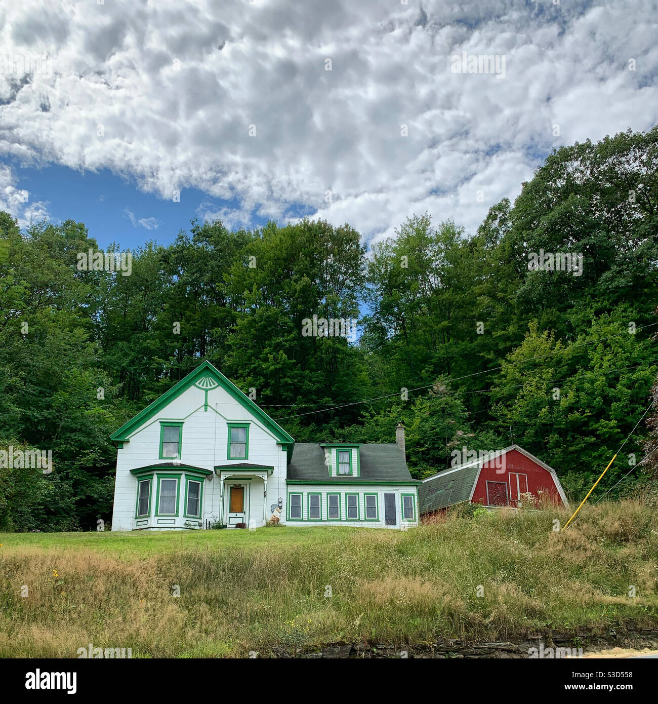 A house and barn in Bath, Grafton County, New Hampshire, United States - Smartphone Captured Stock Image