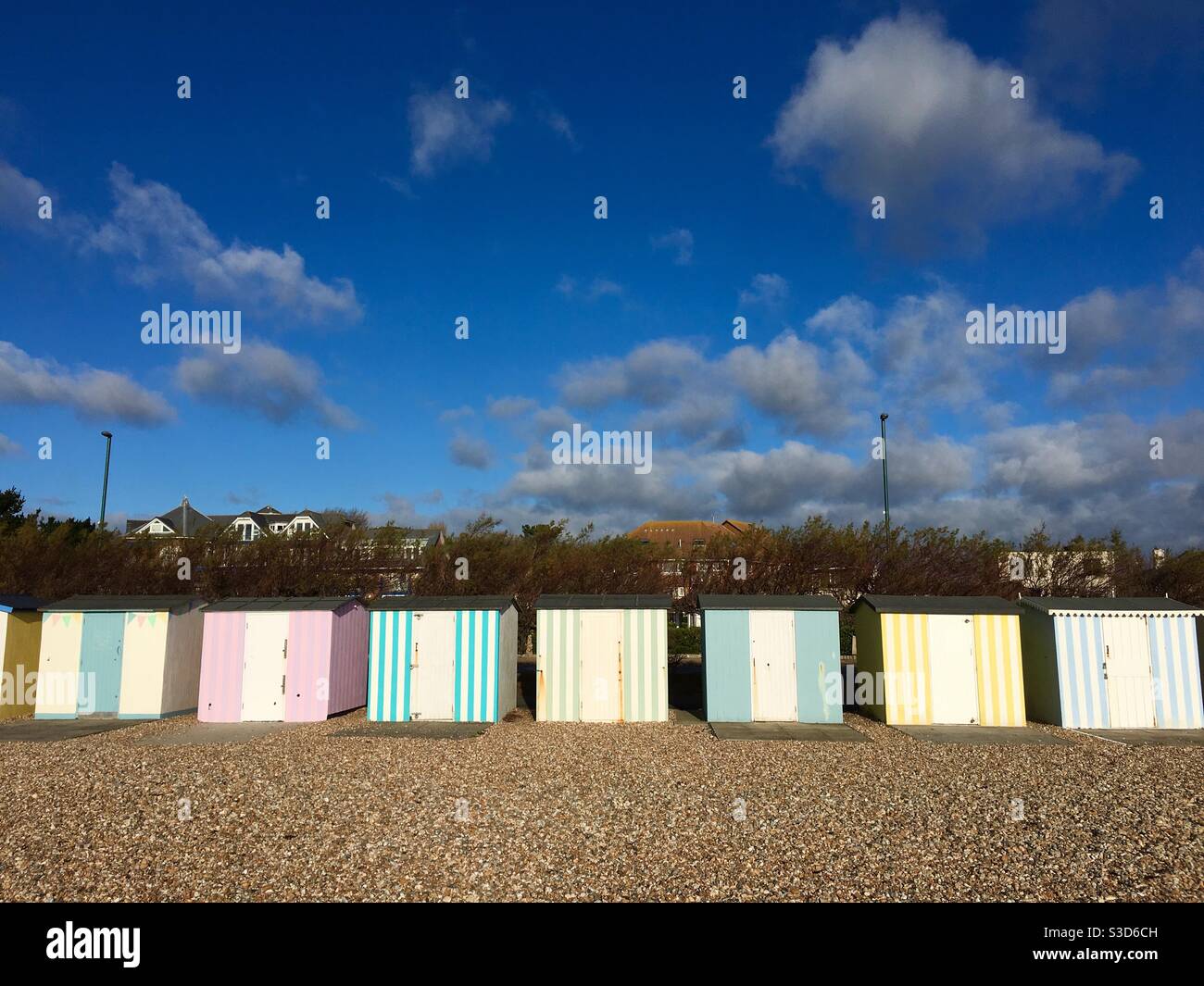 Colourful stripey beach huts Stock Photo