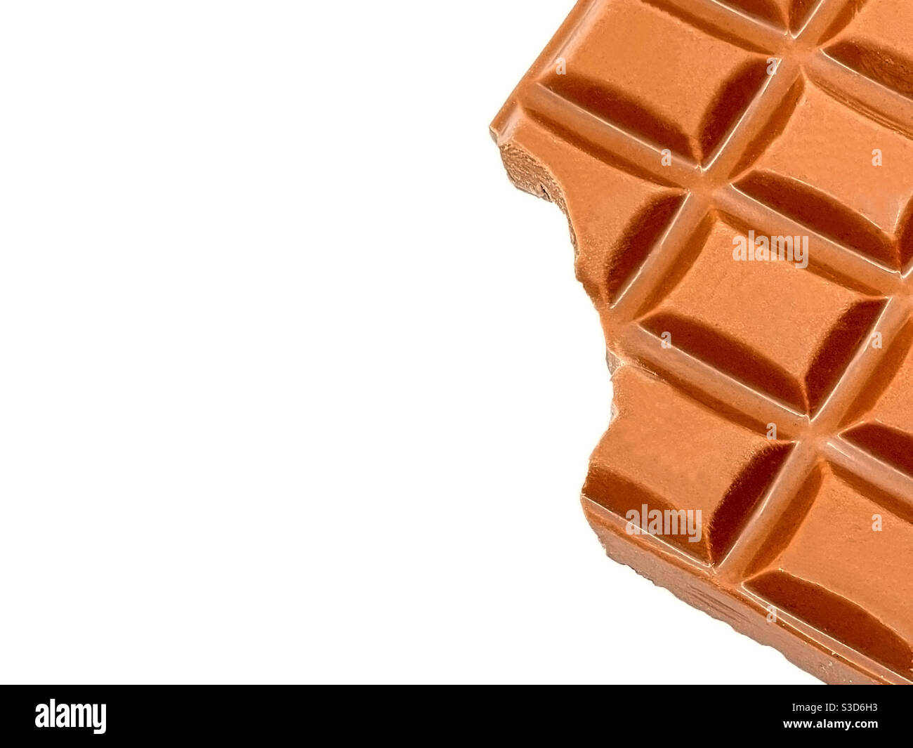 Close up of a large bar of chocolate with a bite taken out. No people. Copy space. Stock Photo