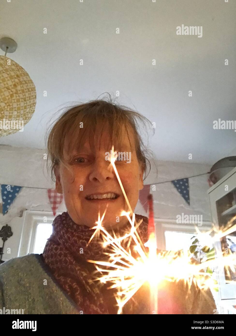 Woman with sparkler - Smartphone Captured Stock Image