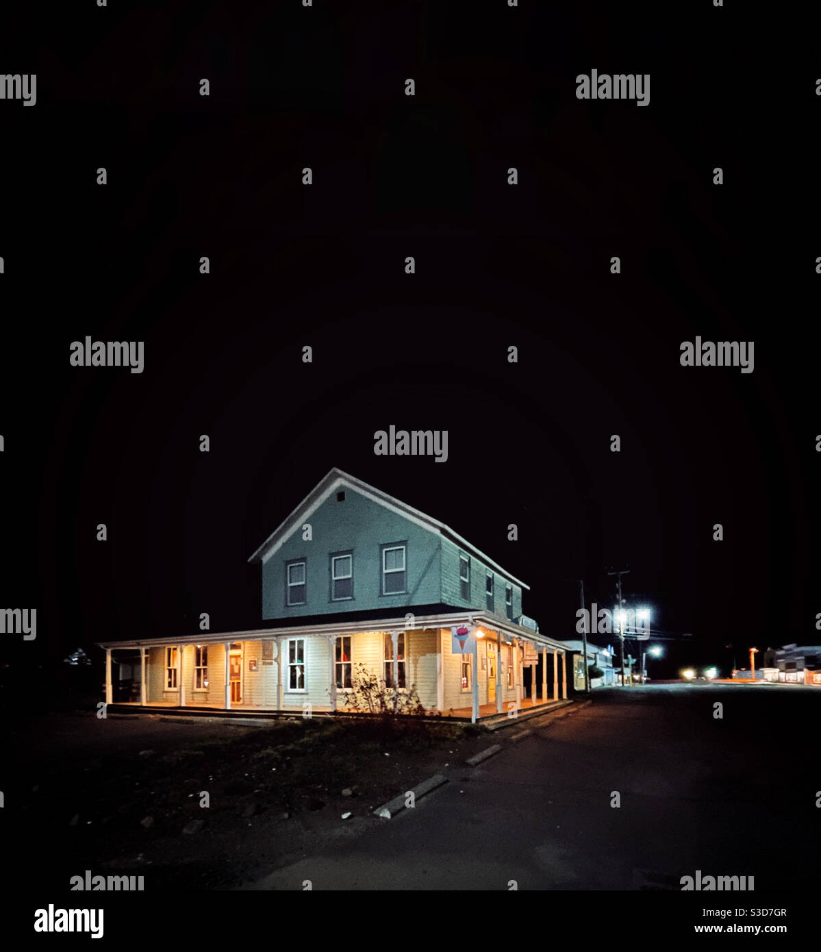 100 years old building in small american town at night - Smartphone Captured Stock Image