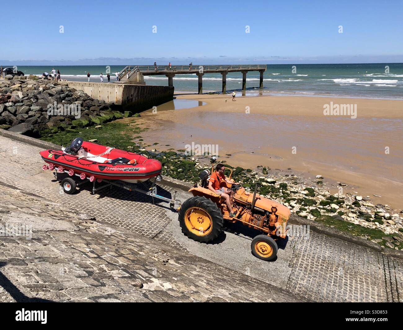 The Société Nationale de Sauvetage en Mer (SNSM)RIB being taken down to the beach by tractor - Smartphone Captured Stock Image