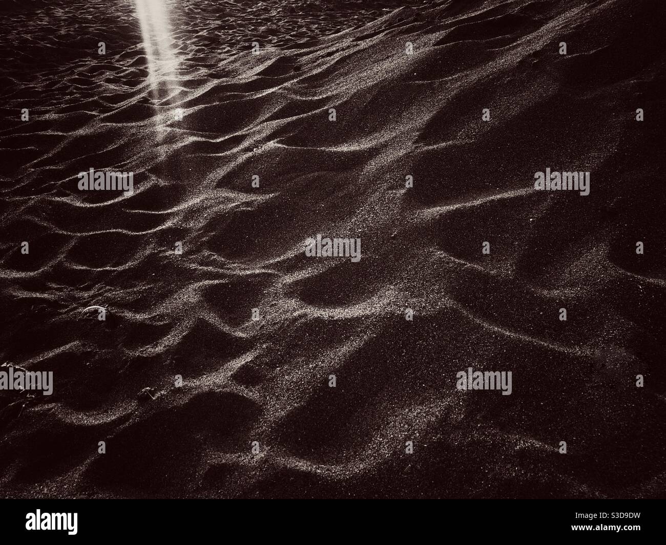 Sandy surface with light leakage on the top corner - Smartphone Captured Stock Image