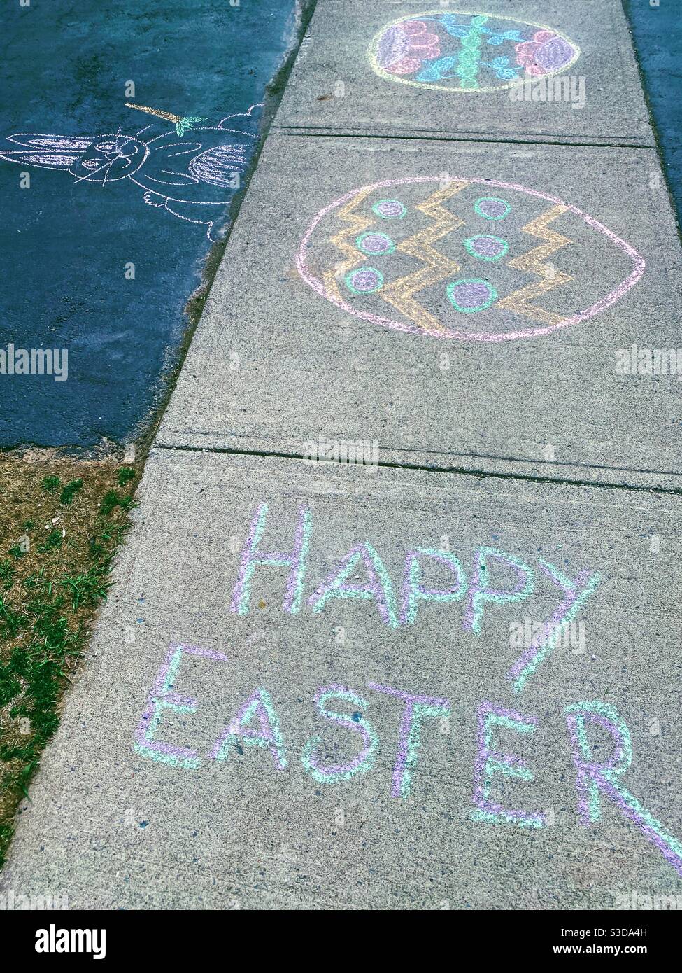 Happy Easter written on sidewalk during lockdown 2020 - Smartphone Captured Stock Image