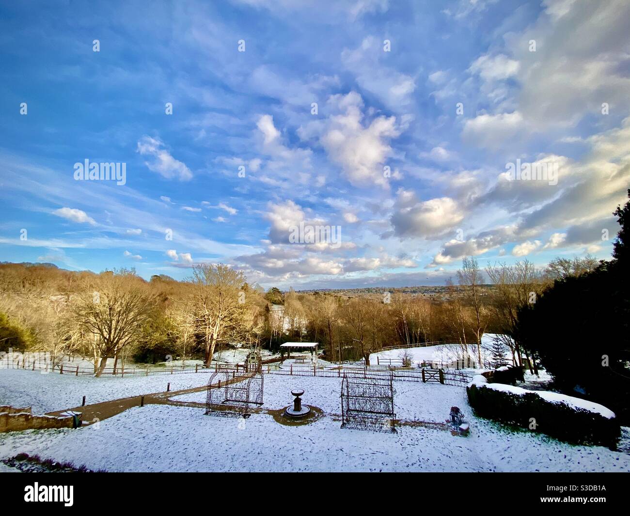 Picturesque view of old woodland and picturesque winter scene with snow from The Beacon near Tunbridge Wells in Kent UK Stock Photo
