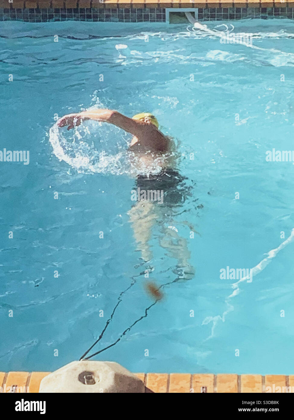 Older woman swimming in pool hi-res stock photography and images - Alamy