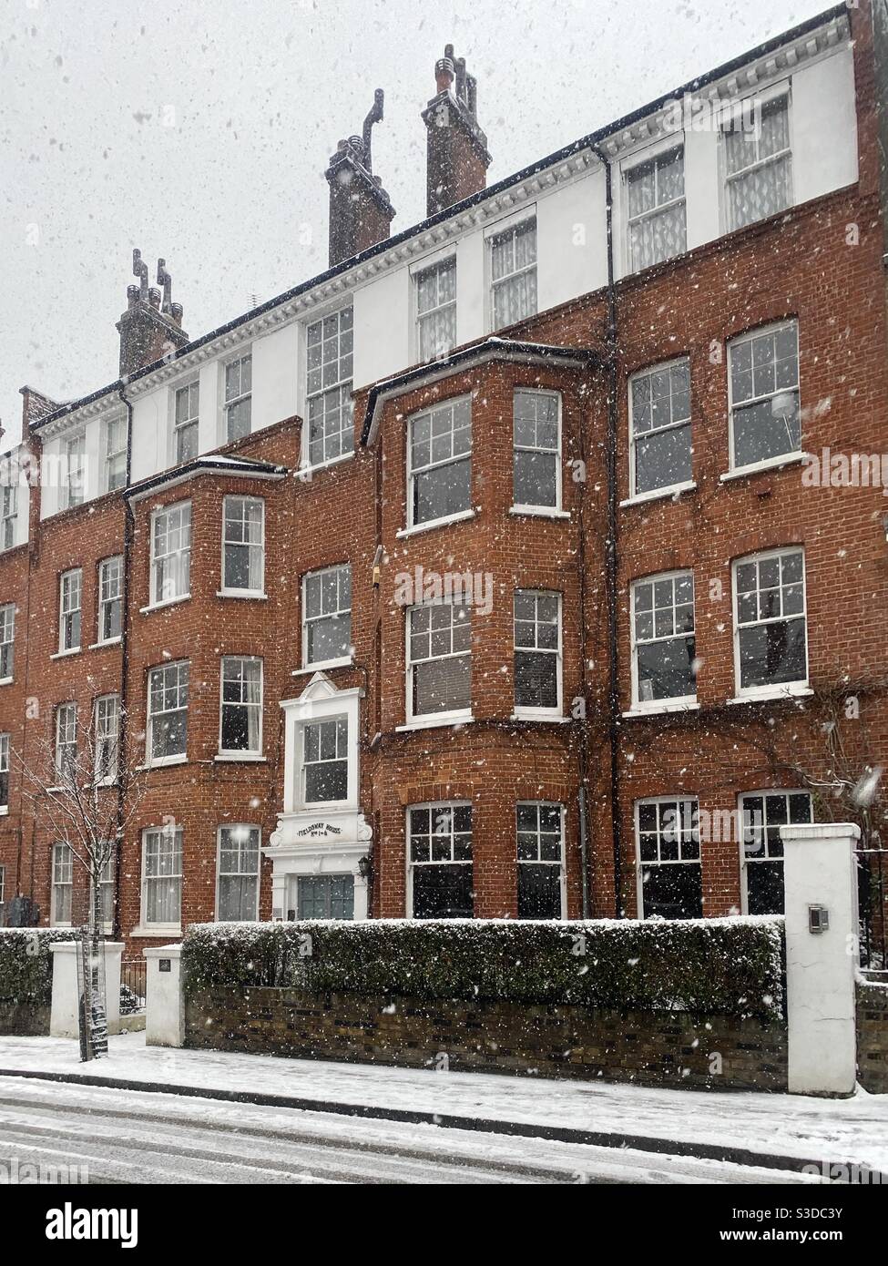 Snow falling North London street - Smartphone Captured Stock Image