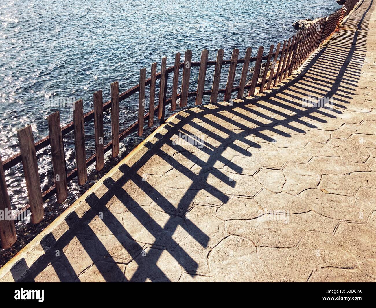 Fences and its shadow by the sea - Smartphone Captured Stock Image