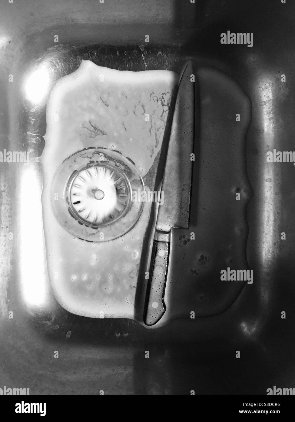 Kitchen knife and kitchen sink Stock Photo Alamy