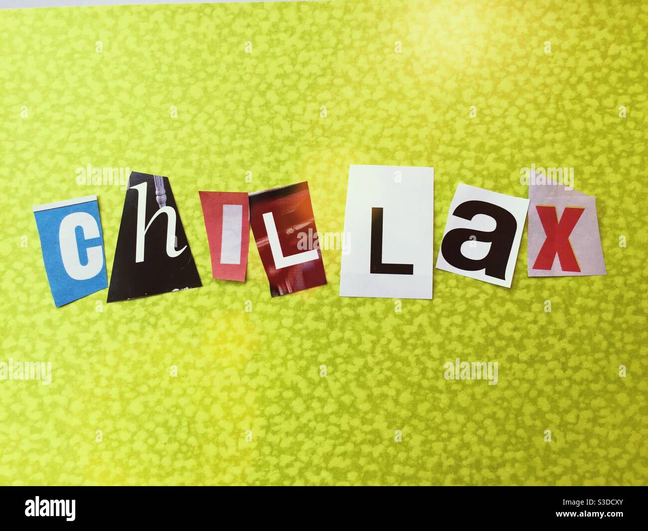 Ransom note style typography spelling CHILLAX, USA - Smartphone Captured Stock Image