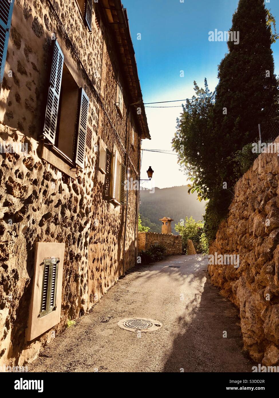 Sundown over the path of an old mountain village - Smartphone Captured Stock Image