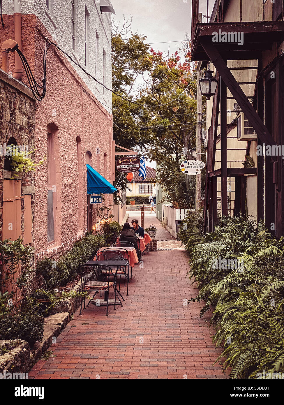 Cafe seating on Artillery Lane between Aviles Streer and Charolette Street in the St. Augustine, Florida Historic District. - Smartphone Captured Stock Image