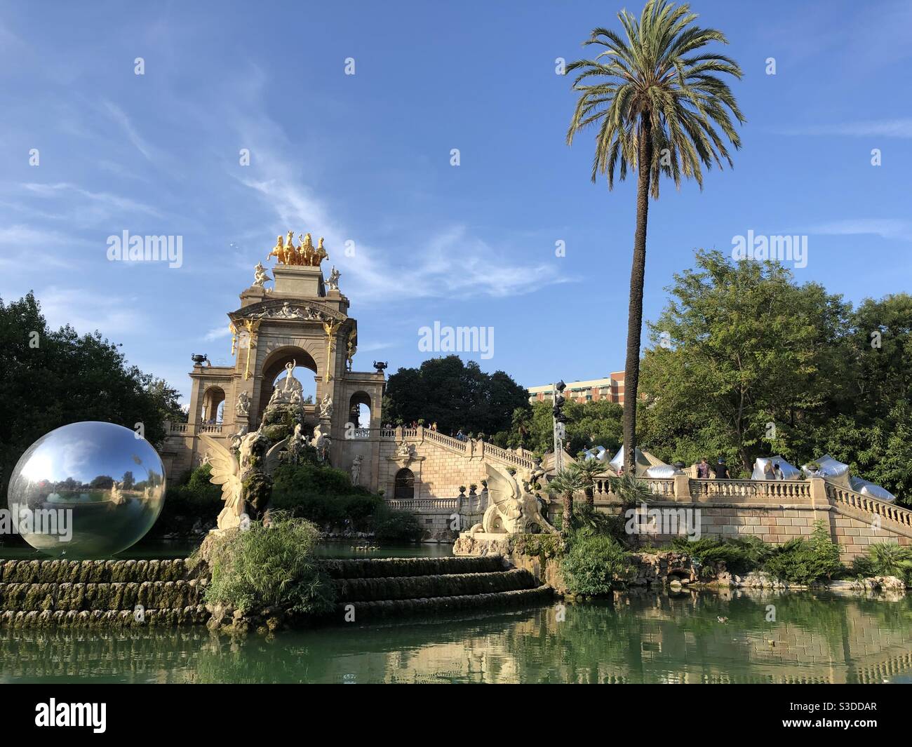 Giant silver sphere in the pond/ fountain at Citadel Park, Barcelona, Spain, Europe Stock Photo
