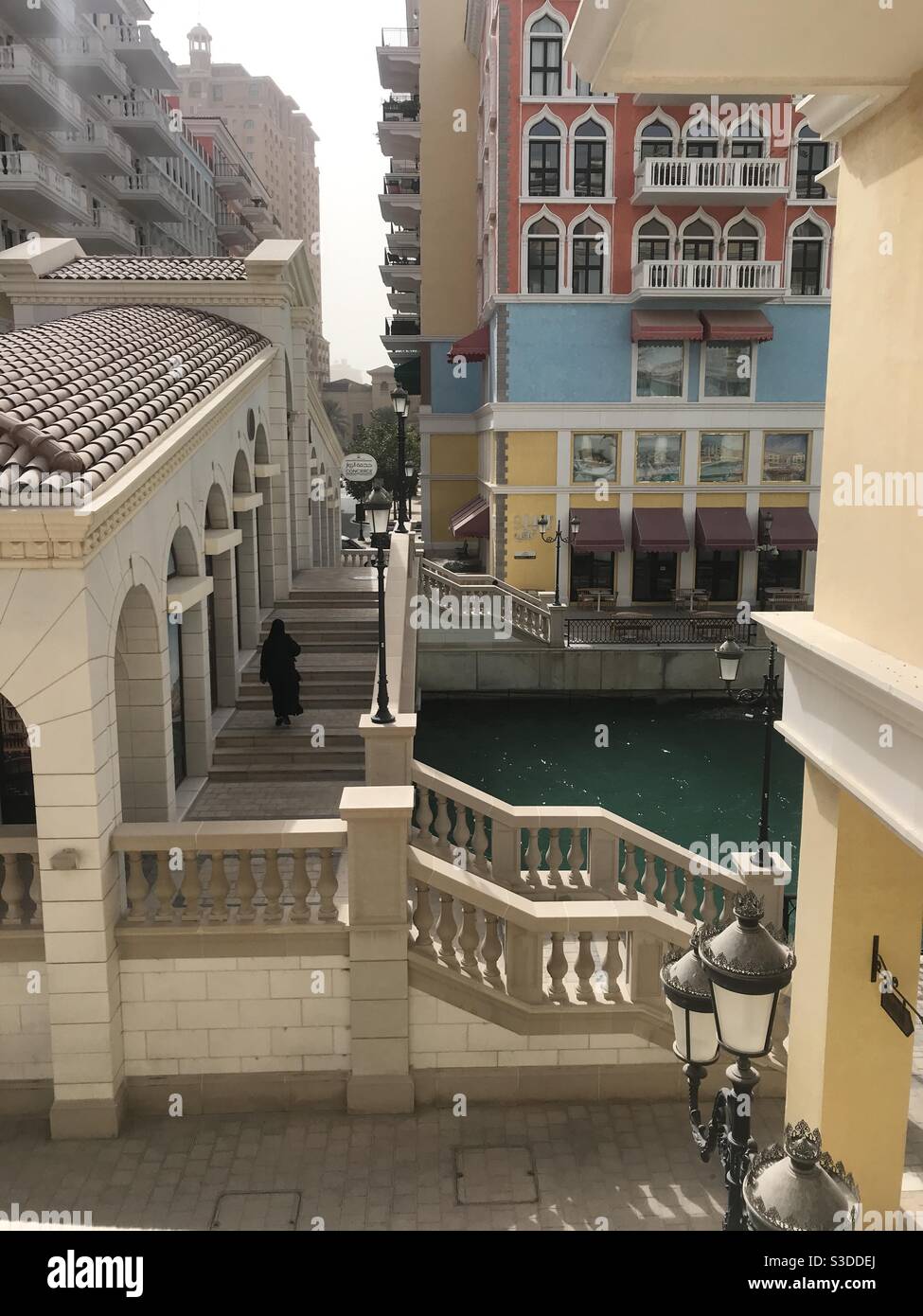 The beautiful colourful buildings of Qanat Quartier on the artificial island of The Pearl, Doha, Qatar - Smartphone Captured Stock Image
