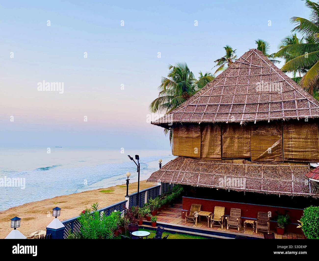 A traditional thatched restaurant on Varkala beach, Kerala India Stock