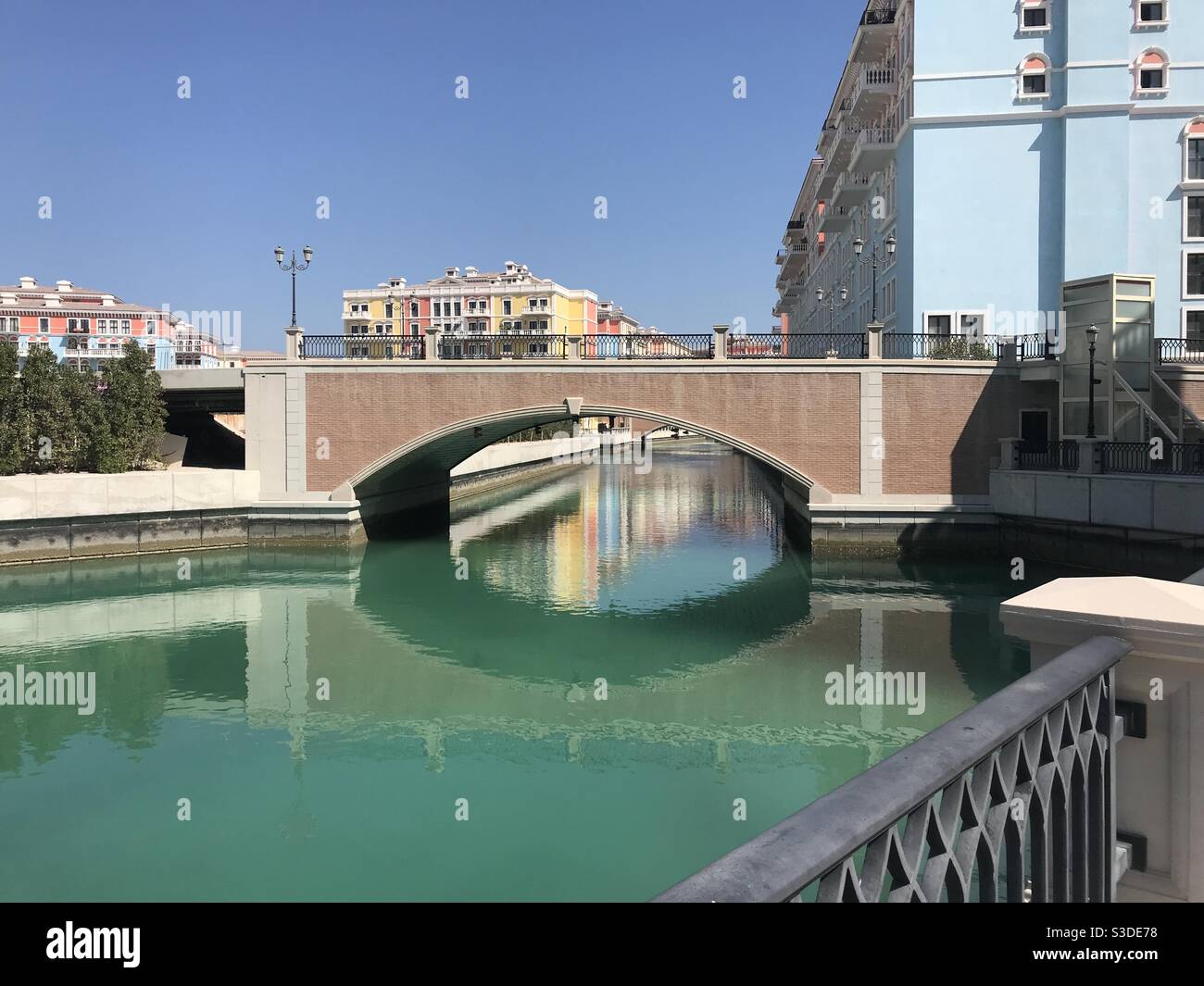 The beautiful bridges and canals of Qanat Quartier on the artificial island of The Pearl in Doha, Qatar - Smartphone Captured Stock Image