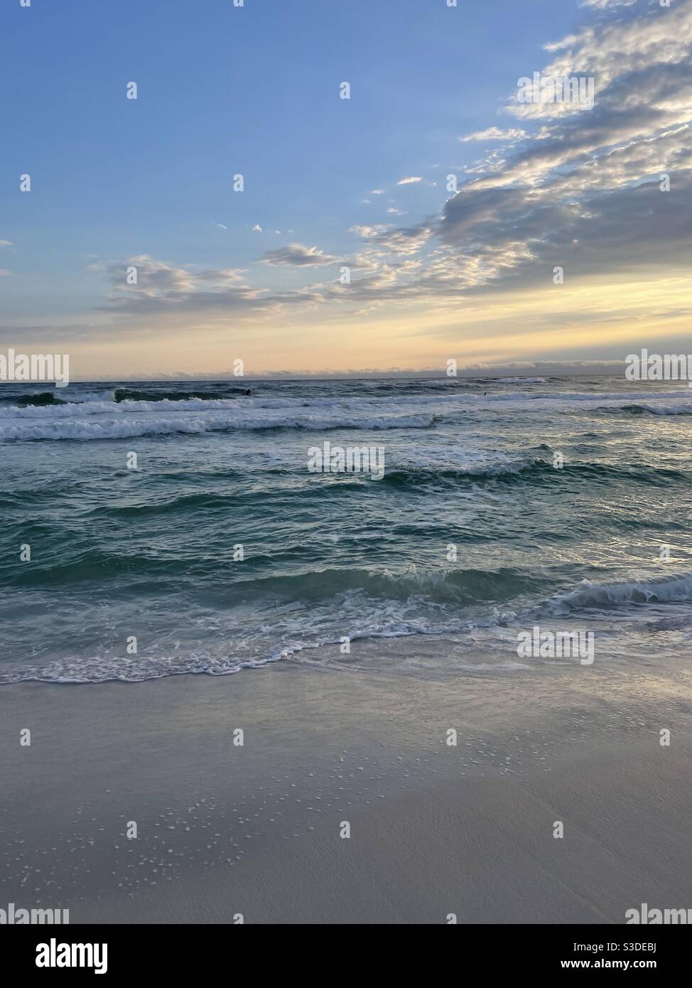 Large rolling waves with sunset skies over the Gulf of Mexico Florida - Smartphone Captured Stock Image