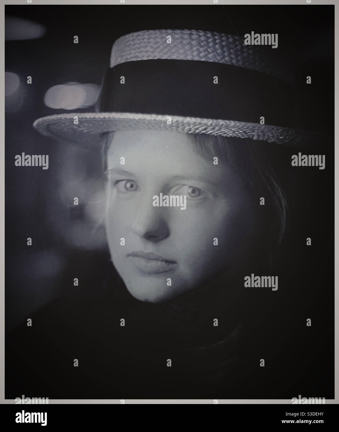 A young woman in a straw boater hat. - Smartphone Captured Stock Image
