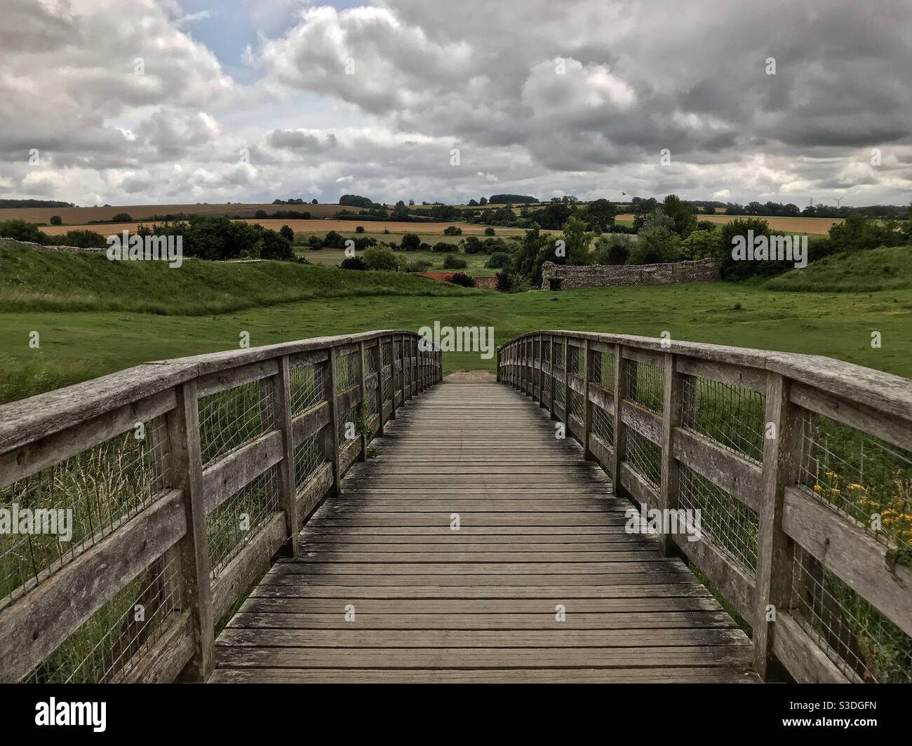 Bridge over the old moat within the castle ruins at Castle Acre, near Swaffham, Norfolk, England. - Smartphone Captured Stock Image