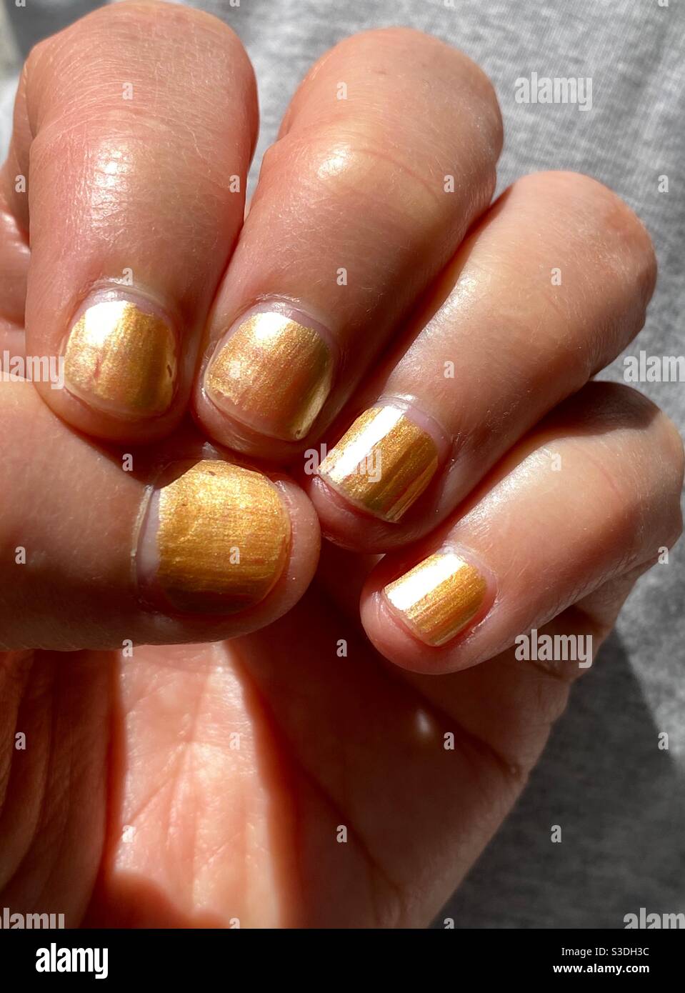 Gold fingers Stock Photo