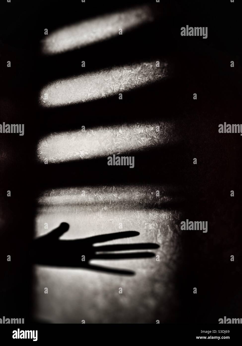 Dramatic image showing shadow of a hand Stock Photo - Alamy