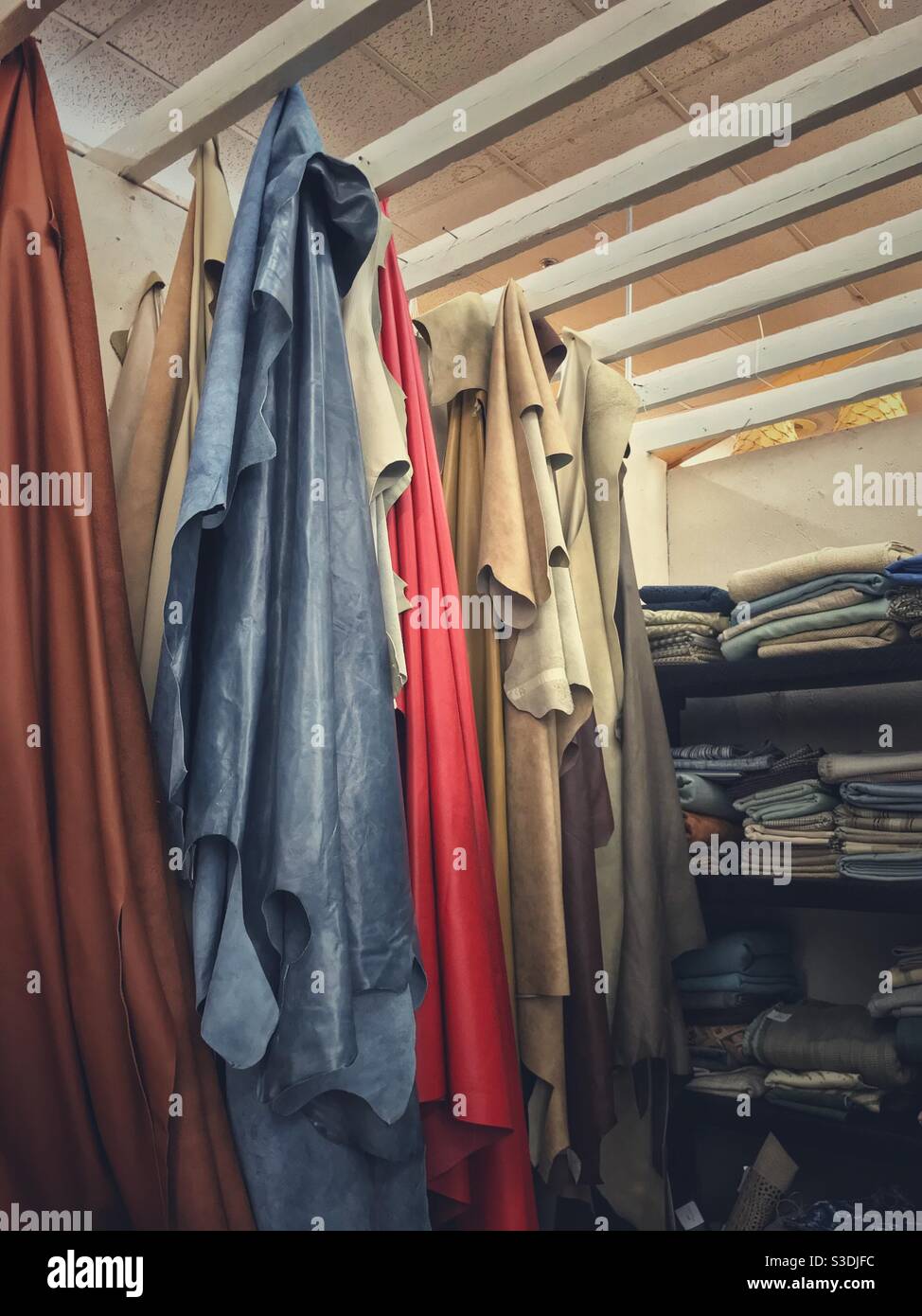 Leather pieces and scraps for sale in antique mall display - Smartphone Captured Stock Image