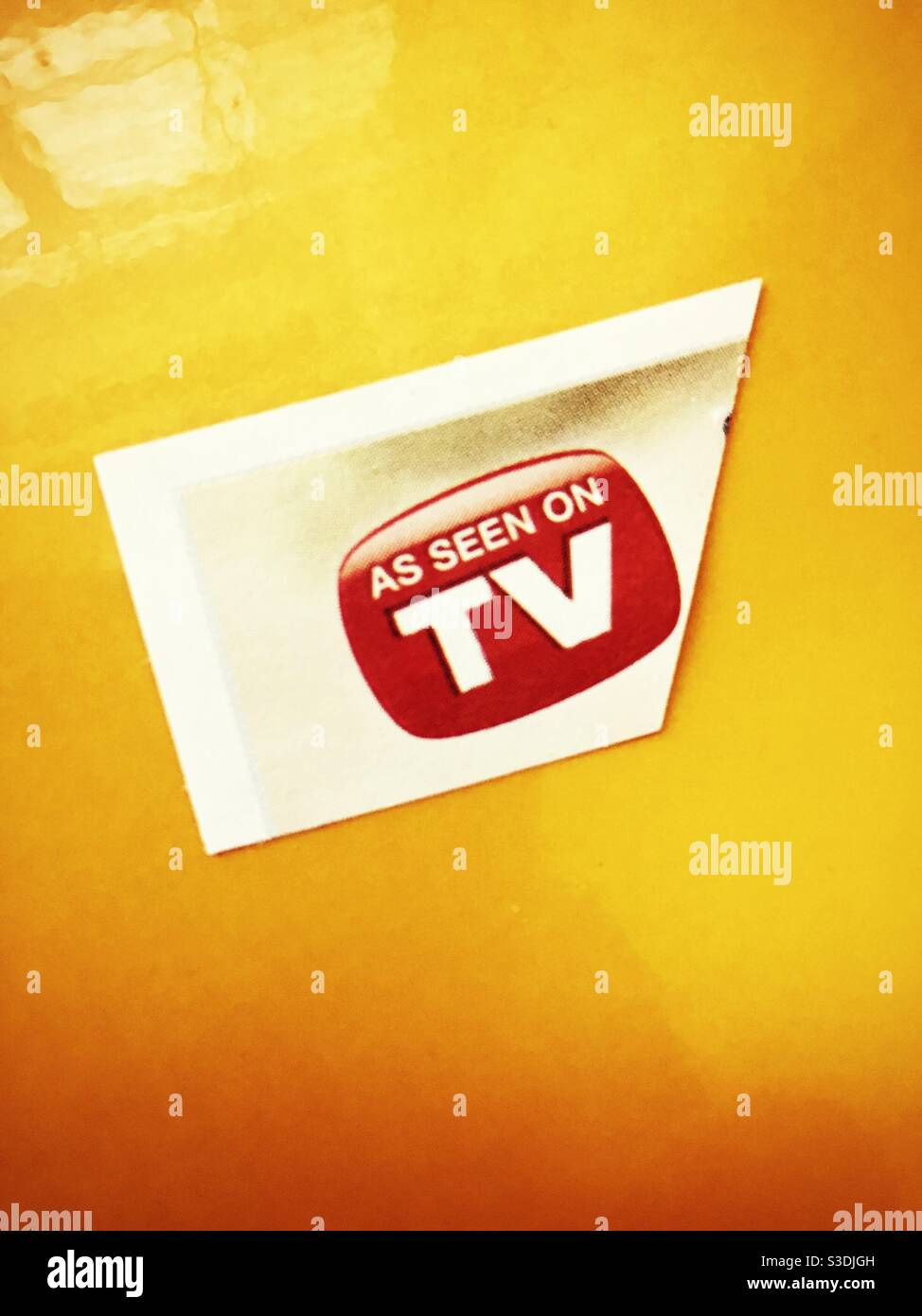 As seen on TV advertisement on a yellow background, USA - Smartphone Captured Stock Image