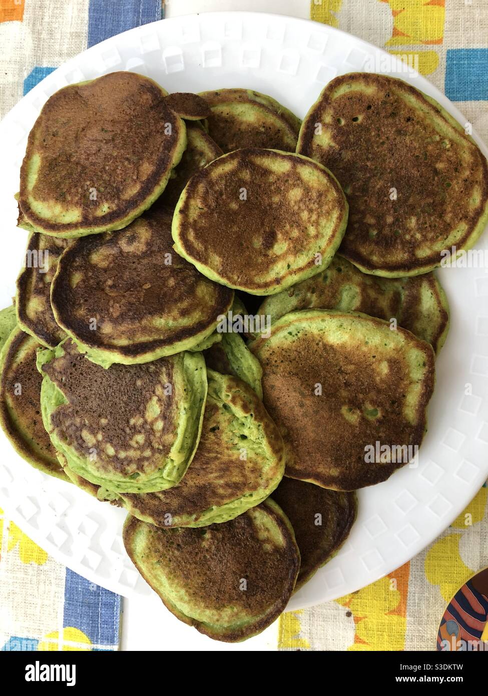 Green spinach pancakes to celebrate St-Patrick’s Day breakfast. - Smartphone Captured Stock Image