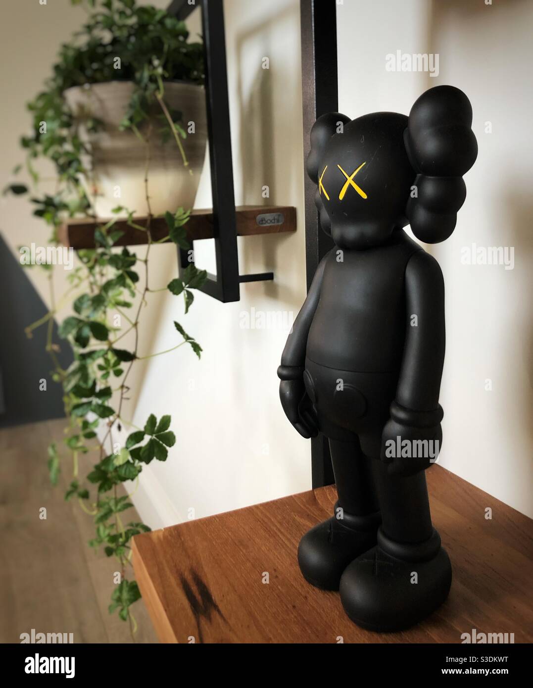 Designer art toy on a shelf Stock Photo Alamy