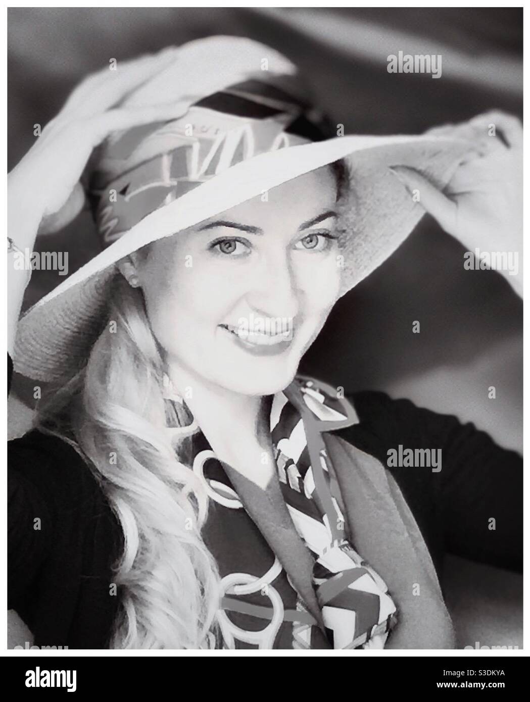 A young blonde woman smiling. - Smartphone Captured Stock Image