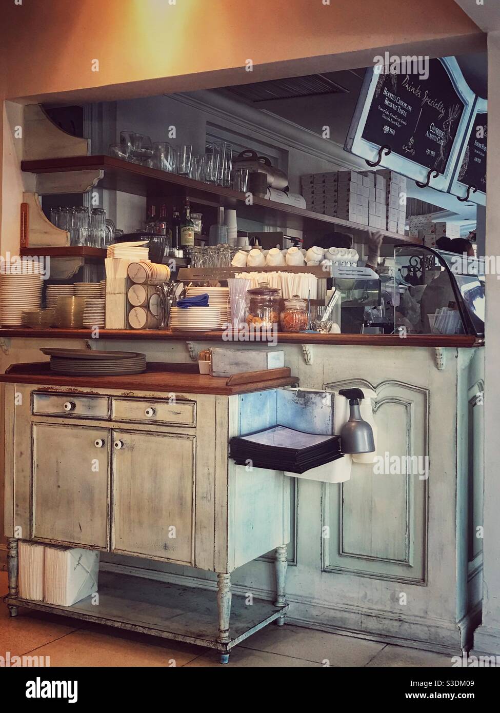 Retro styled coffee shop interior with counter display and serving area  hatch. Vintage styled fitting are also evident Stock Photo - Alamy